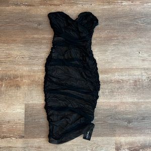 Little black dress. Rouched, strapless and very sexy. With tags on. Never worn.